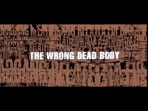 Trailer frame with interrogation room glass; the soundtrack’s songs echo lies, loyalty, and pressure