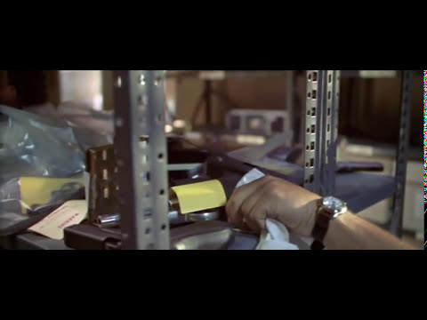 Gang Related (1997) official trailer frame – Belushi and Shakur in a tense corridor, hinting at the film’s gritty hip-hop palette