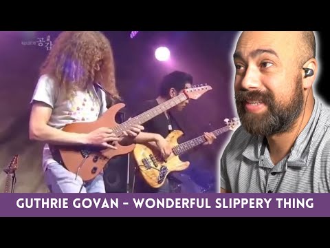 “Is Guthrie Govan Even Human? 🎸 Classical Guitarist Reacts to ‘Wonderful Slippery Thing’”