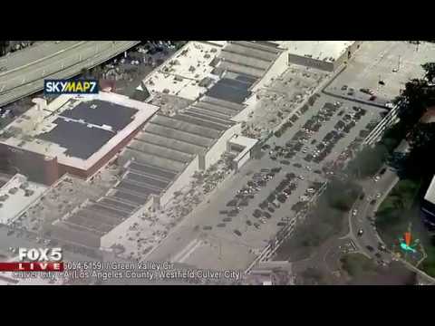 Burglary suspect fleeing from police hides in parking garage