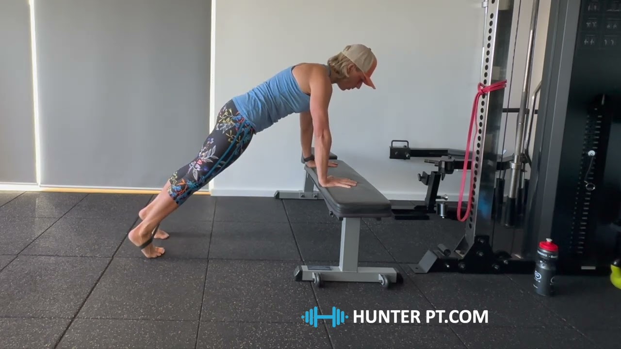 High plank (hands on bench) hip flexor march