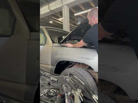 Adjusting an aftermarket fender to get the hood gap right.