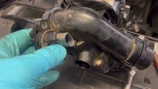 ￼￼￼ 2012 Audi Q5 2.0.T ￼ DIY replace water pump thermostat housing  ￼￼And temperature sensor