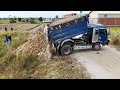 First Activity New Project Dump Trucks With KOMATSU Dozer Filling Flooded Land Next To The Road