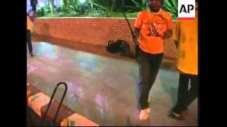 WRAP Protesters and police at government house; ADDS more clashes