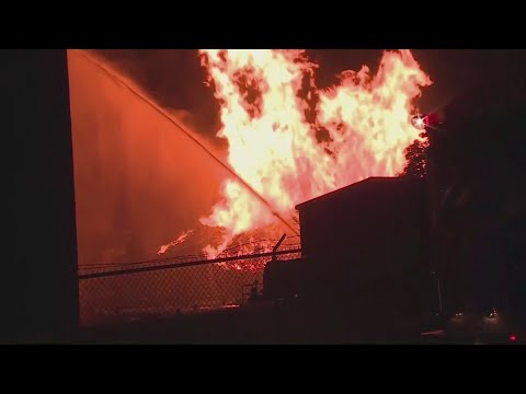 A massive Jim Beam warehouse filled with 45,000 barrels of bourbon was destroyed by a fire that sent flames shooting into the night sky and generated so much heat that firetruck lights melted, authorities said Wednesday. (July 3)