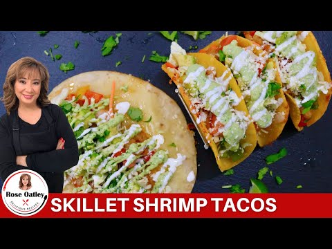 BEST SHRIMP TACOS topped with a Creamy Avocado Cilantro Sauce