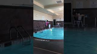Ari Brownlee kicking ball in the pool