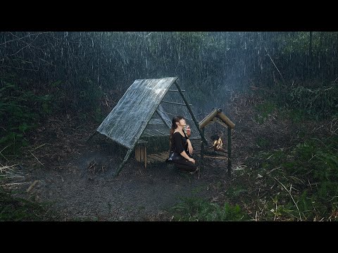 Building a camp with plastic wrap in heavy rain