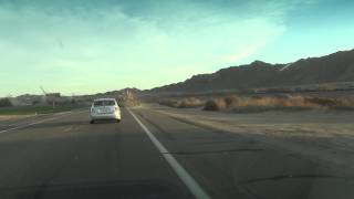 preview picture of video 'Tractor pulls large Farm Instrument down Highway 95, Yuma, Arizona'
