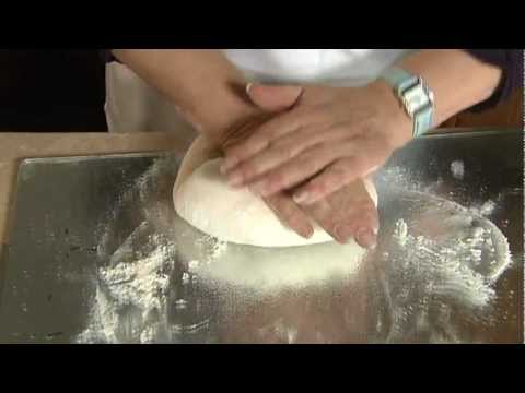 How do you knock back and knead a yeast mixture?