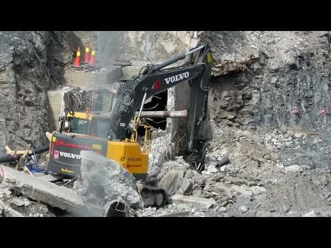 Volvo ECR235C L digging and moving concrete