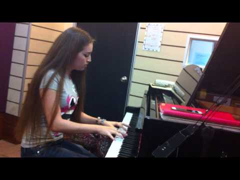 Mama Treble Clef Studio-Nigina playing piano