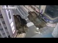 Moment huge sinkhole opens swallowing a four-lane crossroads, Japan