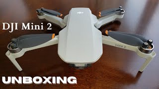 DJI Mini 2 Unboxing Fly More Combo | small portable 4k drone with first flight