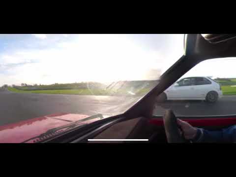 Toyota starlet kp on a lap around Donington park.