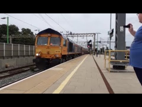 GBRf 66728 passes through Watford Junction hauling a fully loaded car train 26/07/23