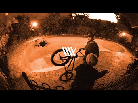 Boyd Hilder, Alex Hiam, Raph Jeroma-Williams and the LUXBMX crew ride an abandon pool.