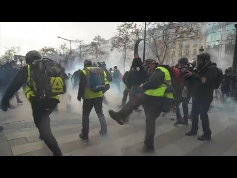 Police fire tear gas and rubber bullets as 31,000 protesters take to the streets across France