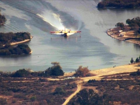 Watch: Calif. wildfire water bombers take on thousands of gallons in seconds