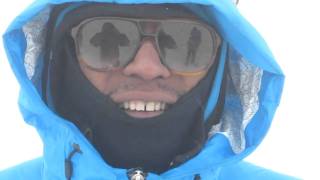 Lupe Fiasco on top of Mt. Kilimanjaro with Kenna's Summit on the Summit