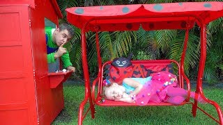Stacy and Dad repairing playhouses