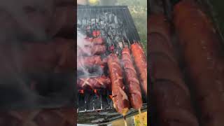 Charcoal grilling hot dog on a stick 🤤