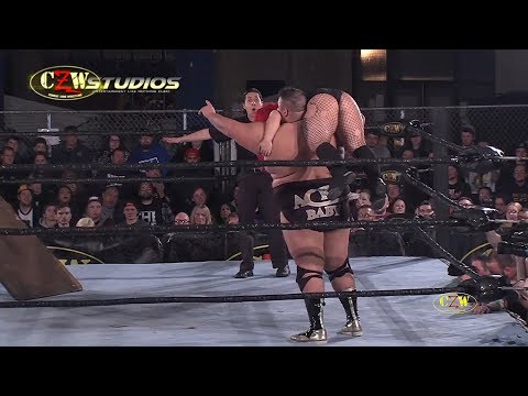 Ace Romero smashes Chrissy Rivera through a table | CZWstudios.com | Cage of Death 19