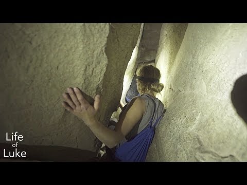 Squeezing through caves under Skaha Bluffs, Penticton