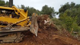 Caterpillar D6c vs Rocks