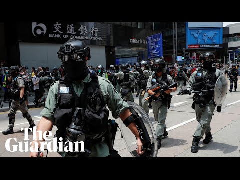 Hong Kong crisis: protesters and police clash over new anthem law