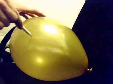 popping balloon with pen