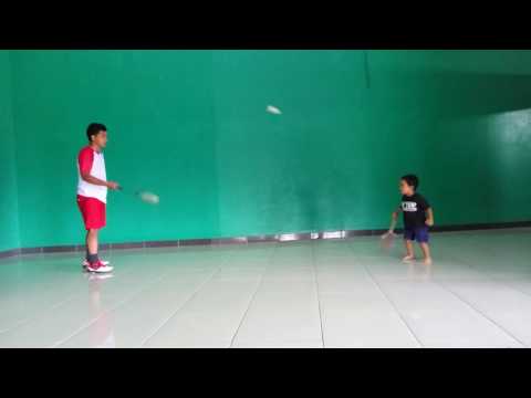 3 years old boy playing badminton