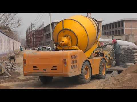 Self Loading Concrete Mixer, Feeding Cement to Cement Bucket