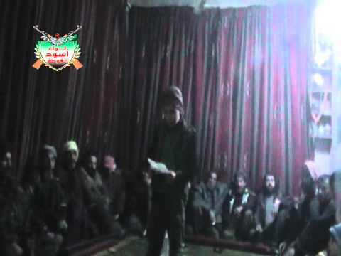 طفل يلقي قصيدة خلال حفل زفاف أحد عناصر لواء أسود الغوطة في ريف دمشق