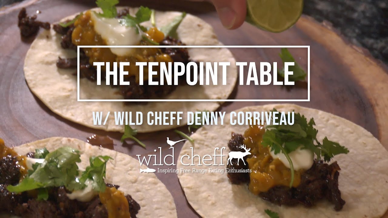 TenPoint Crossbow Technologies is proud to partner with Celebrity Game Chef Denny Corriveau to bring you The Tenpoint Table – a video recipe series rooted in the “field to table” concept of sustainable living.

Ingredients and Shopping List: 
2 pounds of meat, cubed (Bear, Deer, Elk, Antelope)
1 small Sweet Onion, diced
5 cloves of Garlic, minced
1-2 Tablespoons of WildCheff’s Blackening Rub
2 teaspoons of Ground Cumin
2 teaspoons of WildCheff Roasted Garlic Powder
1/4-1/3 cup of Brown Sugar
Juice of 1 Lime + 1 Lime
1 bottle of Pure Cane Root Beer
Olive Oil
Corn Tortillas
A handful of Cilantro, rough chopped
Sour Cream
Roasted Pepper Salsa 

Directions:
1. Place cubed meat into a large mixing bowl. Season meat with Blackening Rub, cumin, roasted garlic powder and brown sugar. Toss to coat evenly. Let rest for 10 minutes.
2. Heat up a Cast-Iron Dutch oven over medium-high heat. Add olive oil and warm up. 
3. Once the oil is hot, add seasoned meat and sear to brown on all sides. Remove and set aside on a plate. Add oil as needed through the process. 
4. To the heated pot, add diced onion and minced garlic and sauté until onion is translucent and garlic is fragrant (approx.2 minutes).
5. Add seared meat and juices back into the pot, and then add bottle of Root Beer and juice of one lime. (you should have enough Root Beer to cover the meat).
6. Bring to a boil and then back down to a simmer and cover pot. Simmer for 90-120 minutes until meat is fork-tender and can be shredded easily.  It’s important to monitor periodically as stoves can differ, and you want to ensure that you have enough liquid to braise the meat through the whole cooking process. 
7. When the meat is done cooking, remove from stovetop and scoop meat onto a large cutting board and shred with two forks or rough chop meat with a Shark Butcher Knife. 
8. Heat up tortillas by placing on hot Cast-Iron pan or outdoor grill to lightly brown and warm through. 
9. Place some of the Barbacoa meat in the center of warmed tortilla and top with your favorite salsa, followed by a dollop of sour cream and a sprinkle of fresh chopped Cilantro. 
10. Squeeze a bit of lime juice over the top and enjoy with refried beans and rice.