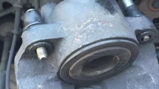 Replace the caliper guide pin sleeve on a Dodge Grand Caravan or Town and Country