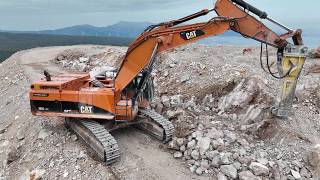 CAT 385C Excavator with Epiroc HB 1000 Breaker Prepares Wind Turbine Base at 1,000m Altitude