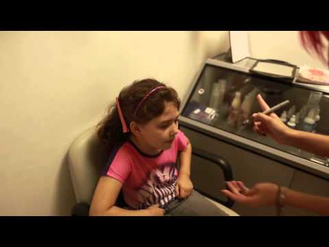 Caitlin gets her ears pierced