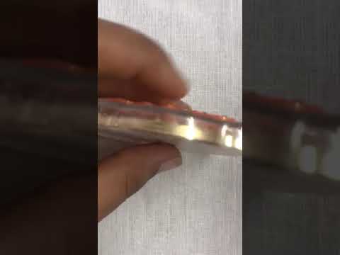 Plastic golden aum pyramid