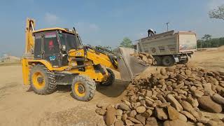 Jcb Loading stone in a Tata 2523c Dumper 10wheeler Dumper