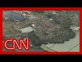 Watch A Massive Tsunami Engulf Entire Towns In Japan 2011