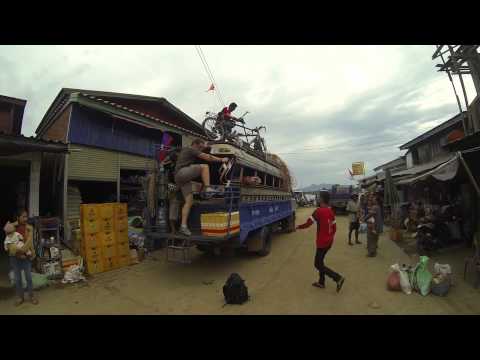 Loading a tandem on a bus, Laos