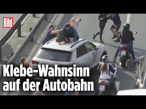 Klimakleber steigen Auto aufs Dach: Autofahrer außer sich
