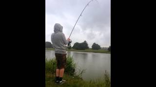 13 year old boy catching a catfish at Claydon