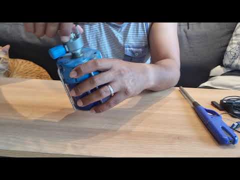 How to install a butane gas canister on a portable gas stove.