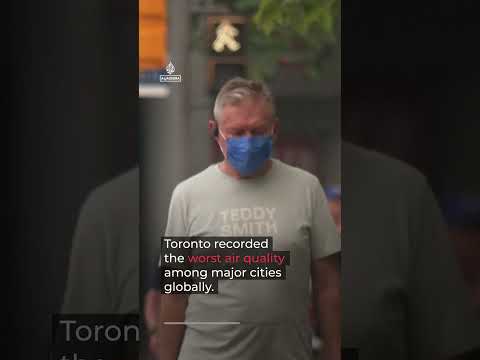 Wildfire smoke engulfs Toronto, Canada and turns its skies orange