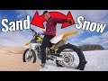Dirt Bike With Paddle Tire Rips In Sand Dunes And Snow