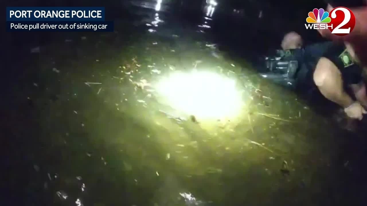 Port Orange officers pull woman from car sinking into canal