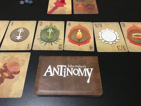 Antinomy with Solo Flare solo expansion. Published by Button Shy Games.
